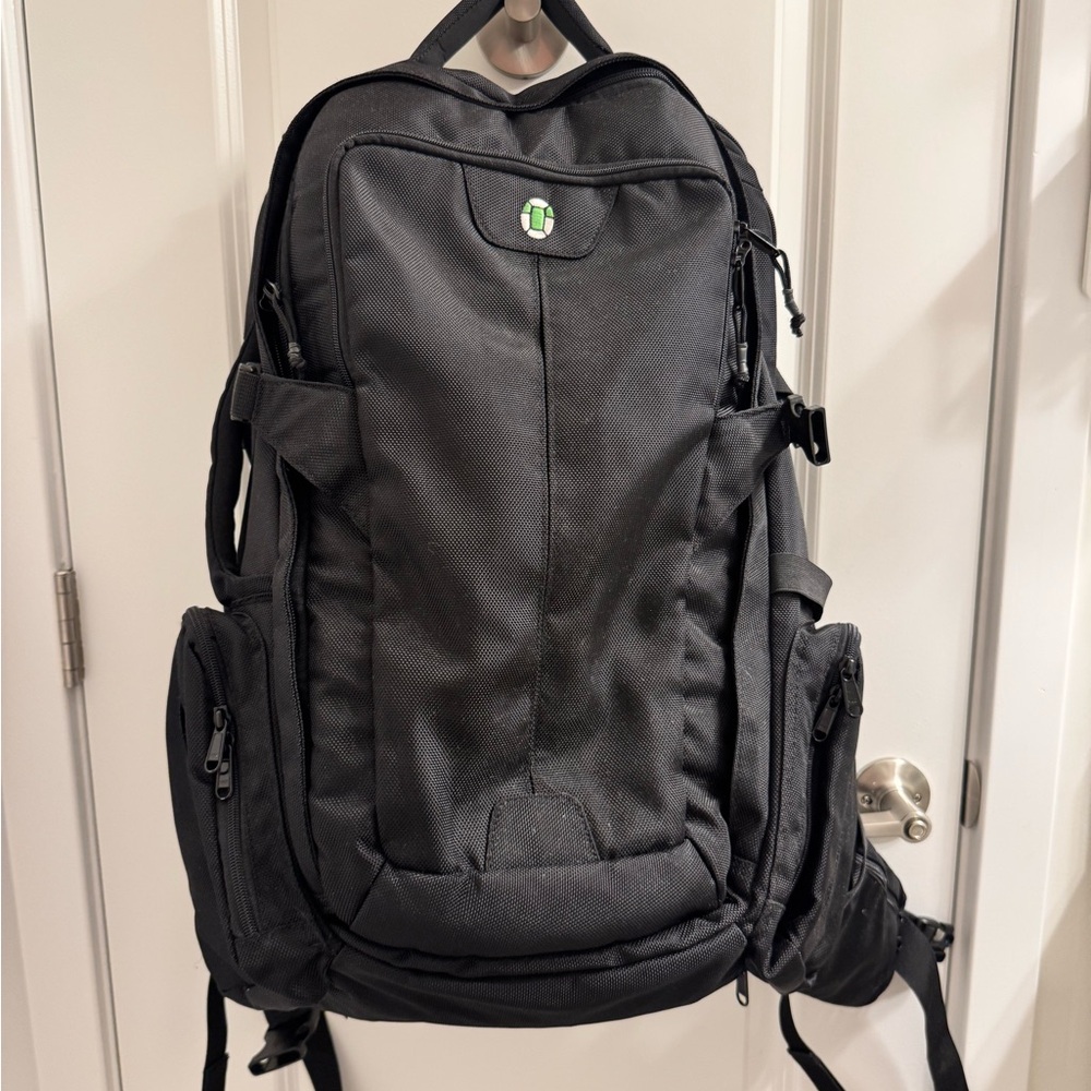 Black TORTUGA Travel Backpack with Durable Design and Multiple Compartments